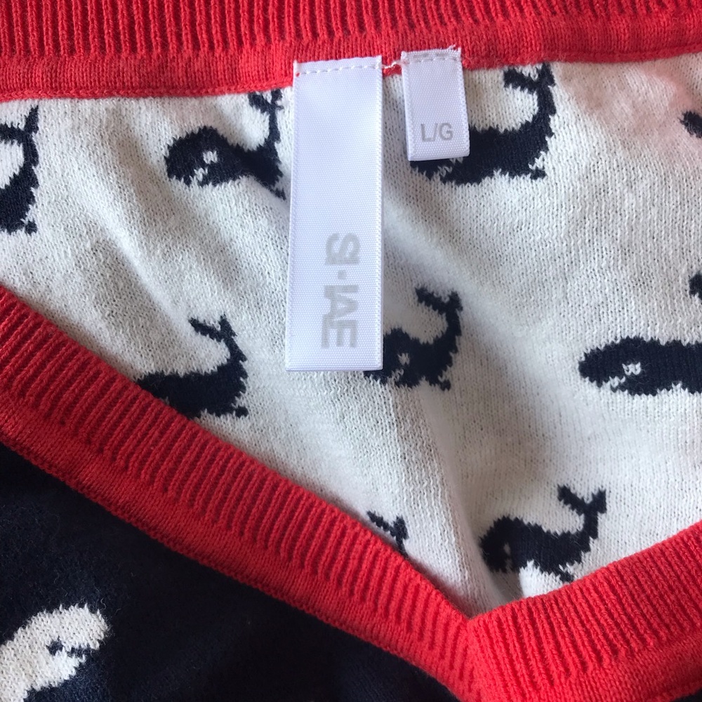 Long sleeve navy and white whale design sweater with red trim. - Picture 3 of 3